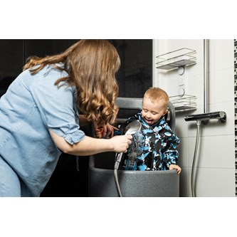 Babystanderi lasten hoito- ja pesuallas